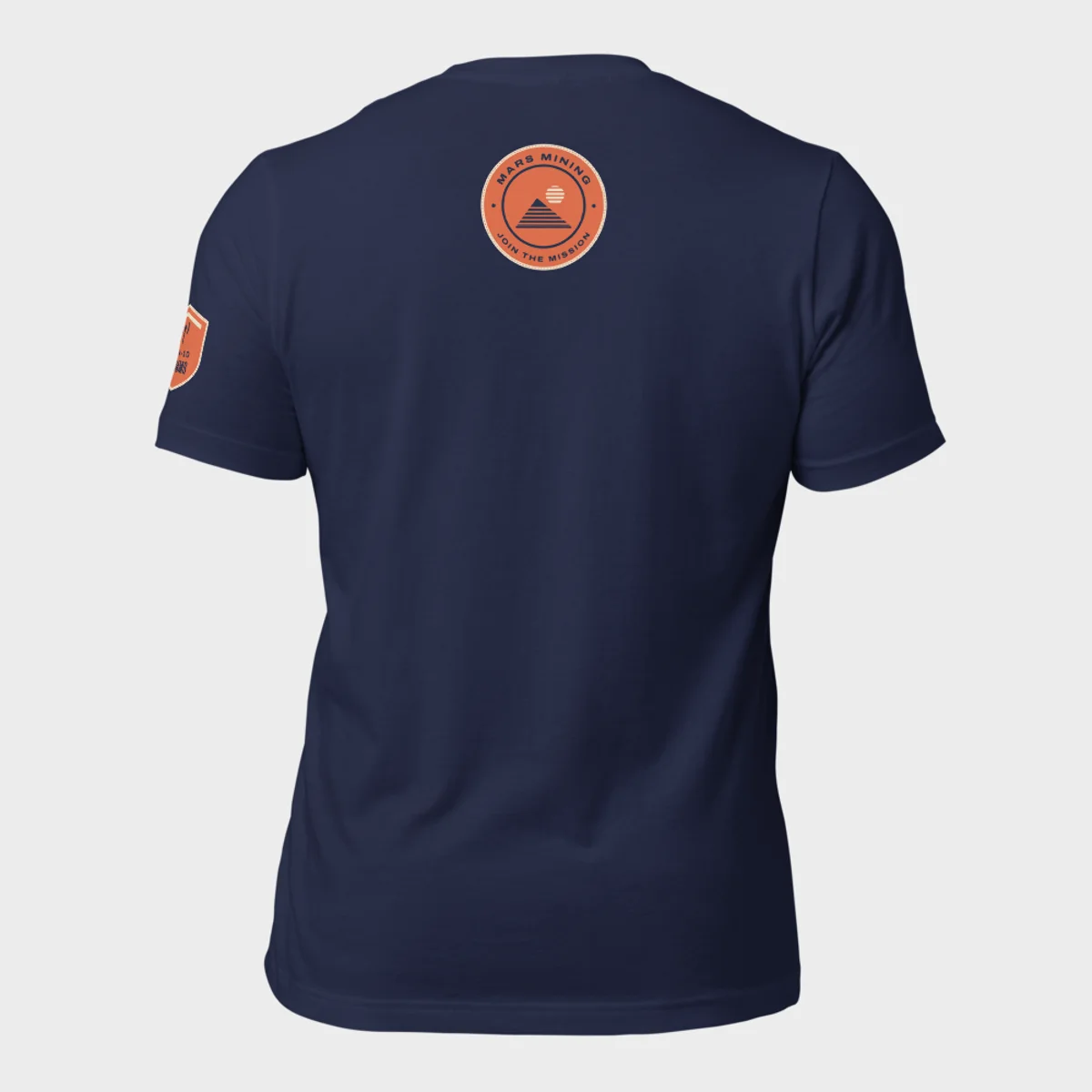 Back of the Comms tee: the round Comms department badge below the collar
