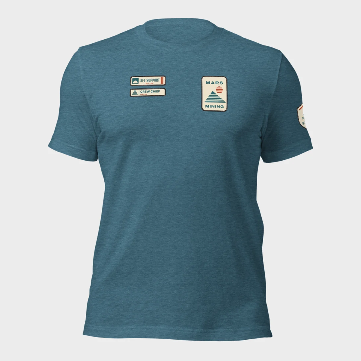 Bella+Canvas 3001 tee in heather deep teal with the Mars Mining badge on the left chest and the Life Support department tag and rank patch on the right chest