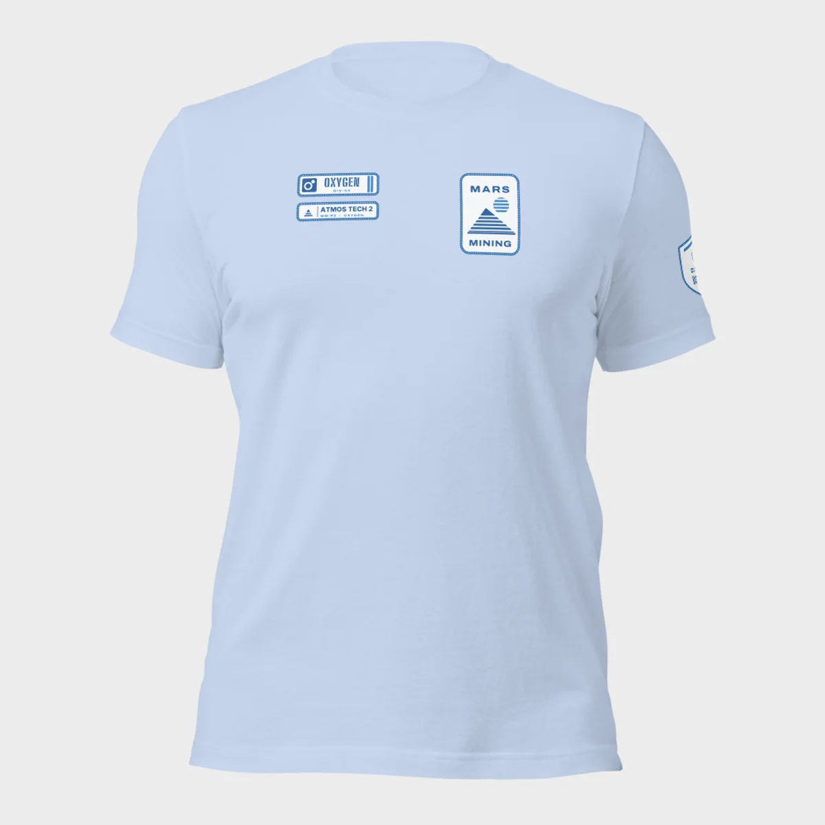 Bella+Canvas 3001 tee in baby blue with the Mars Mining badge on the left chest and the Oxygen department tag and rank patch on the right chest
