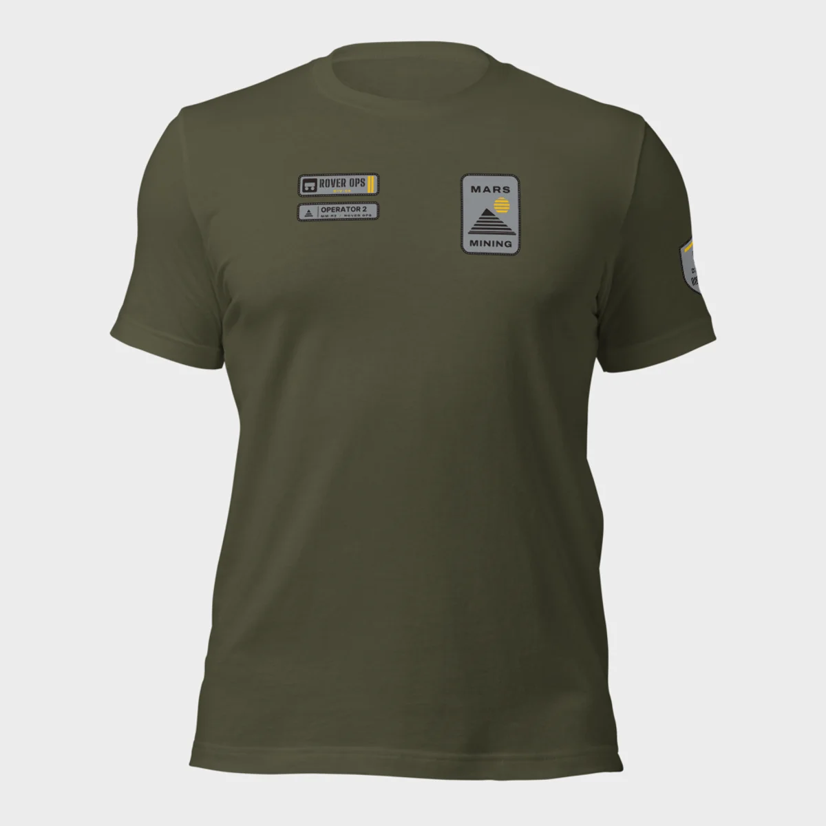 Bella+Canvas 3001 tee in military green with the Mars Mining badge on the left chest and the Rover Ops department tag and rank patch on the right chest